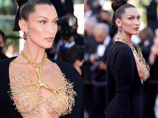 एक्ट्रेस की ड्रेस में जो नेकलेस पहना था वो फेफड़ो जैसा लग रहा है। सोशल मीडिया पर बोला हदीद का ये लुक काफी चर्चा में बना हुआ हैं। बेला हदीद ने ब्लैक गाउन के साथ लाइट मेकअप कैरी किया हुआ हैं।