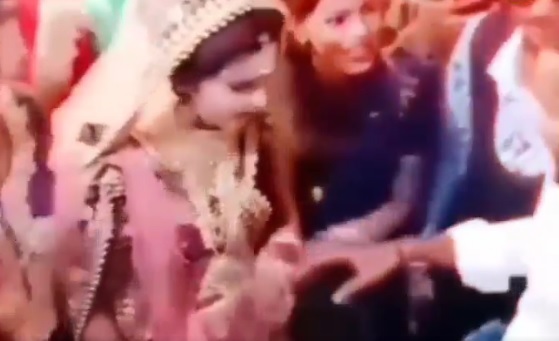 groom caught the hand of another girl