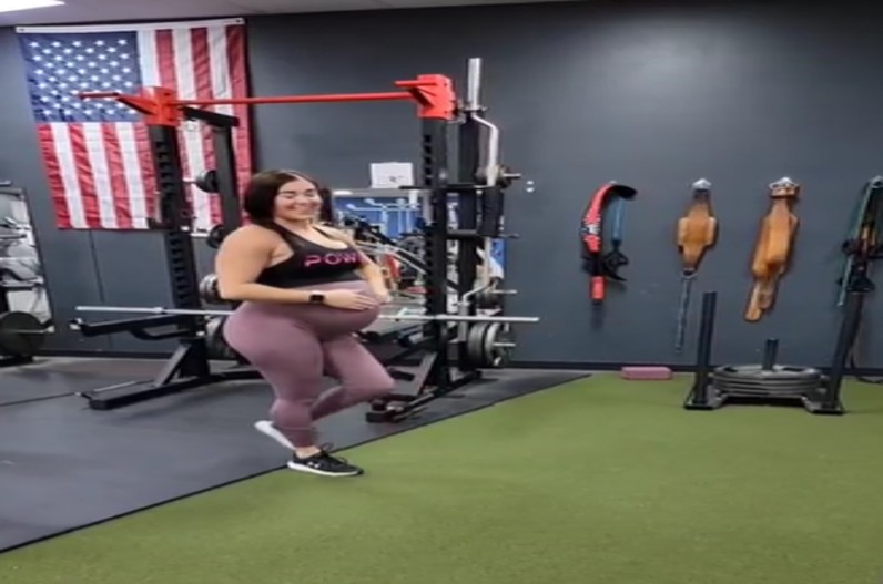 pregnant woman exercising in the gym