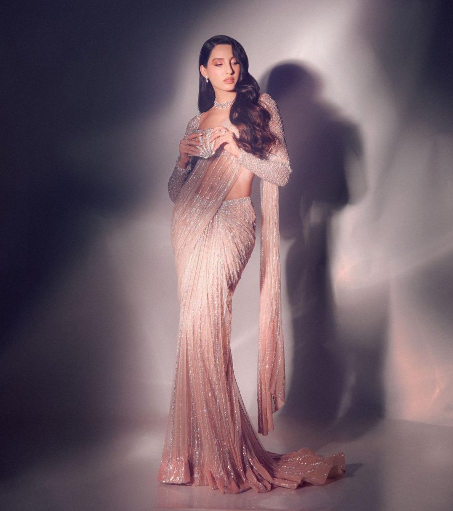 नोरा फतेही एक भारतीय फिल्म अभिनेत्री है उन्होंने 2014 में बॉलीवुड फिल्म रोर: टाइगर्स ऑफ द सुंदरबन के साथ अभिनय की शुरुआत की। नोरा फतेही ने अपने डांसिंग और अपने लुक्स के जरिए काफी बड़ी फैन फॉलोइंग बना ली है।