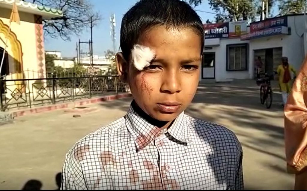 teacher thrashes student with stick