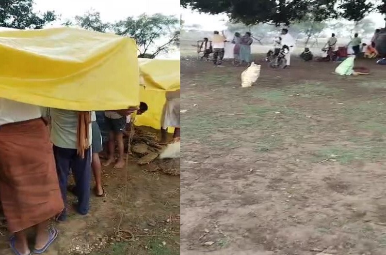 The cremation of the dead body in Muktidham amidst raining water by putting a tarpaulin