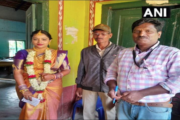 Bride casts vote wearing wedding dress