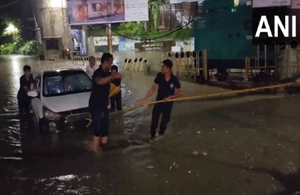 car submerged in waterlogged underpass