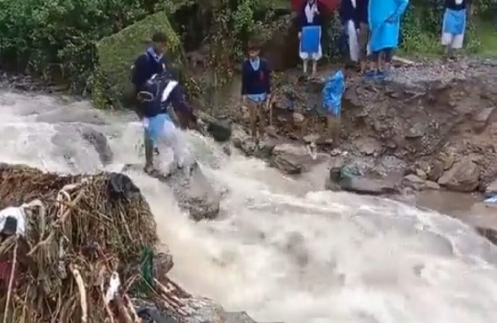children going to school in flood and landslide