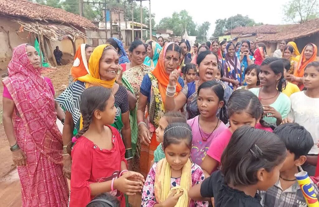 Women guard the village in the evening to stop the sale of illegal liquor