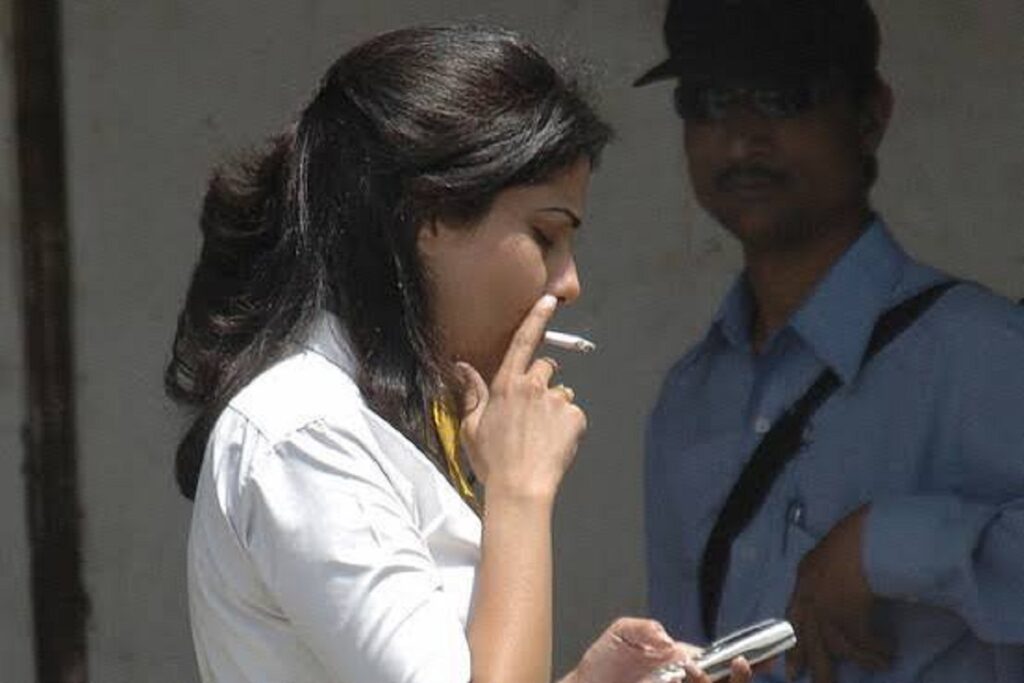 Women smoking cigarette over men