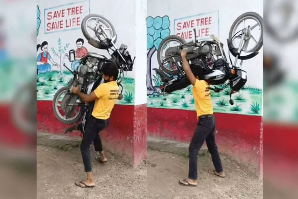 Man carrying bike on shoulder