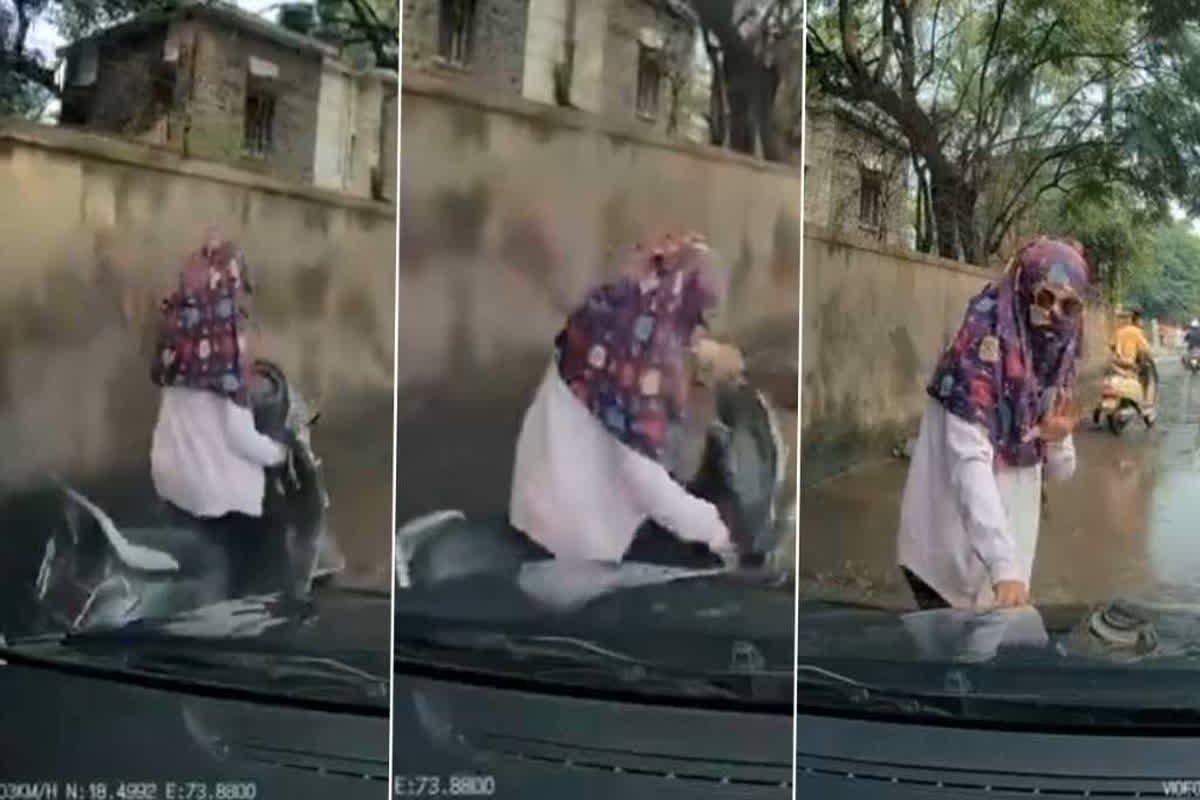 Viral Video : सड़क के गड्ढों के कारण गाड़ी से गिरी महिला, पीछे से आ रही थी कार, वीडियो देख आप भी हो जाएंगे हैरान