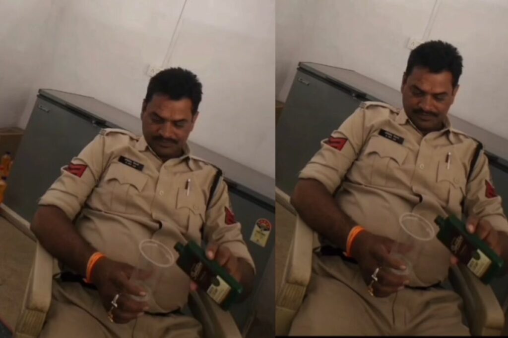 Police Viral Video, policeman drinking in uniform, viral cop video India, Akhilesh Tiwari police video, Bhalumada police scandal, Anuppur viral news, cop drinks liquor on duty,